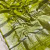 fashionable-olive-green-color-lichi-silk-fabric-with-silver-weaving-work-saree