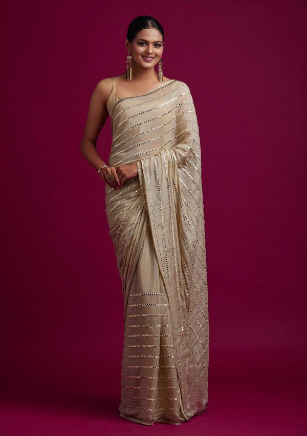 fashionable-gold-color-fancy-mirror-work-trendy-party-wear-saree