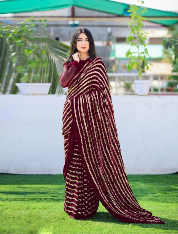 party-wear-maroon-color-sequins-strips-work-saree-with-georgette