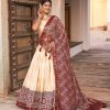 Glamorous Off White Color Tussar Silk Dot And Ajarakh & Drawstring With Foil Printed & Heavy Tassels Lehenga Choli