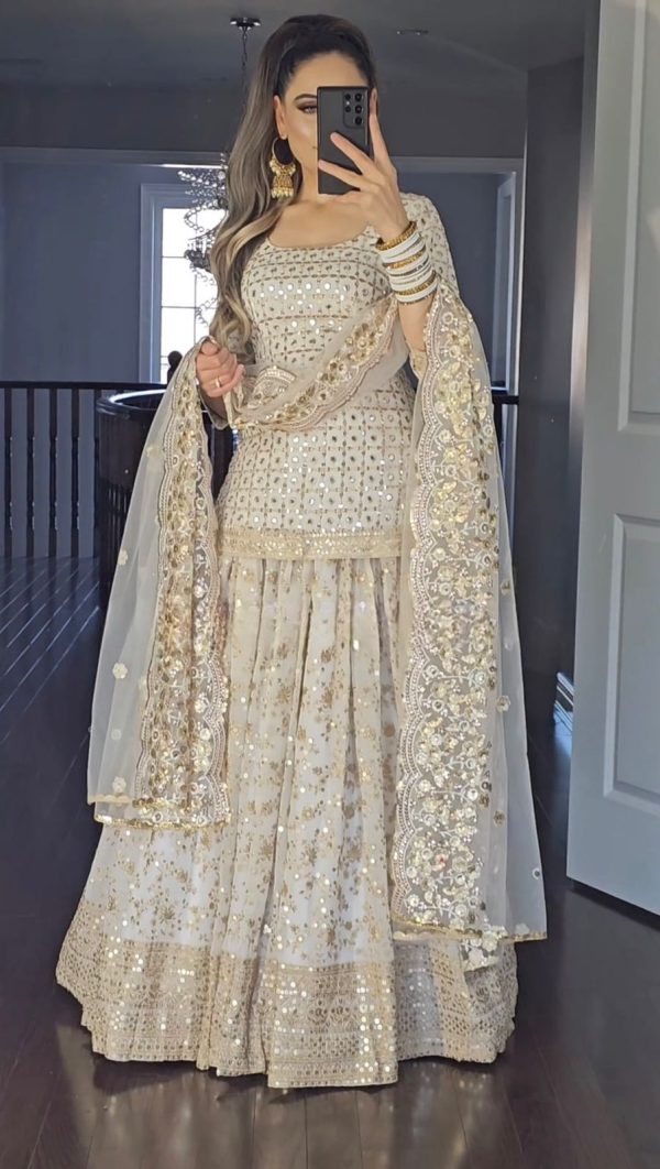 Graceful Golden Color Sequence Multi Needle Work Lehenga Choli