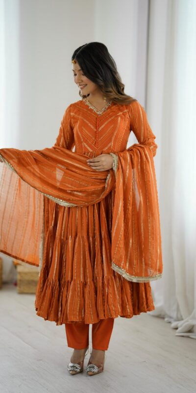 SRK 5305 Orange Color Mal Chanderi Gown with Mirror Work & Lace Work. Grab it for ₹2399. Delivery 4-6 Working Days. Shop now. | Jump Suits, Salwar suit, Casual Suits, Creative suits, Designer Suits, Palazzo Suits, Party Wear Suits, Patiala Suits, Straight Suits