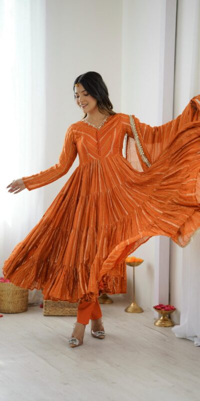 SRK 5305 Orange Color Mal Chanderi Gown with Mirror Work & Lace Work. Grab it for ₹2399. Delivery 4-6 Working Days. Shop now. | Jump Suits, Salwar suit, Casual Suits, Creative suits, Designer Suits, Palazzo Suits, Party Wear Suits, Patiala Suits, Straight Suits