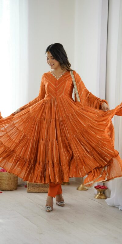 SRK 5305 Orange Color Mal Chanderi Gown with Mirror Work & Lace Work. Grab it for ₹2399. Delivery 4-6 Working Days. Shop now. | Jump Suits, Salwar suit, Casual Suits, Creative suits, Designer Suits, Palazzo Suits, Party Wear Suits, Patiala Suits, Straight Suits