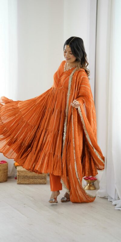 SRK 5305 Orange Color Mal Chanderi Gown with Mirror Work & Lace Work. Grab it for ₹2399. Delivery 4-6 Working Days. Shop now. | Jump Suits, Salwar suit, Casual Suits, Creative suits, Designer Suits, Palazzo Suits, Party Wear Suits, Patiala Suits, Straight Suits