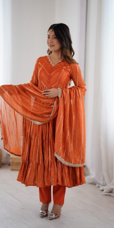 SRK 5305 Orange Color Mal Chanderi Gown with Mirror Work & Lace Work. Grab it for ₹2399. Delivery 4-6 Working Days. Shop now. | Jump Suits, Salwar suit, Casual Suits, Creative suits, Designer Suits, Palazzo Suits, Party Wear Suits, Patiala Suits, Straight Suits