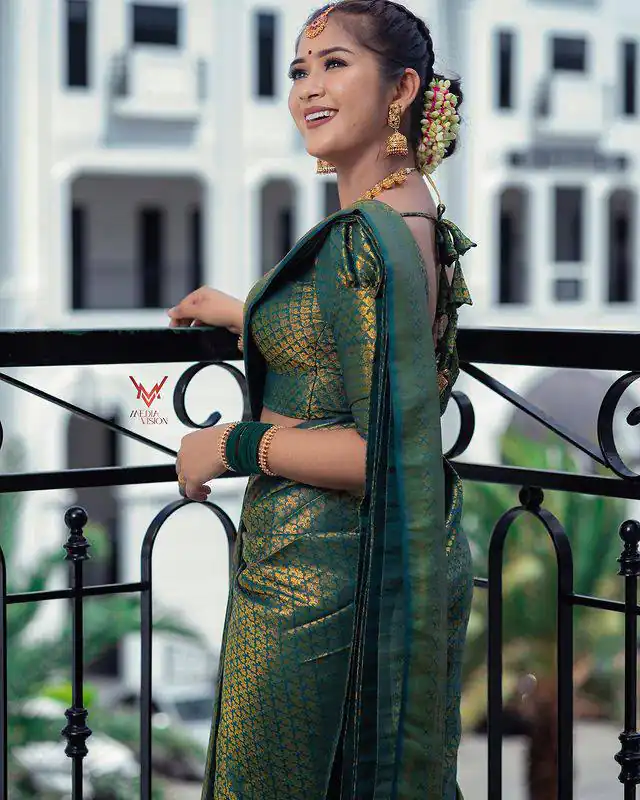 Aglow Green Lichi Silk Jacquard Work Saree